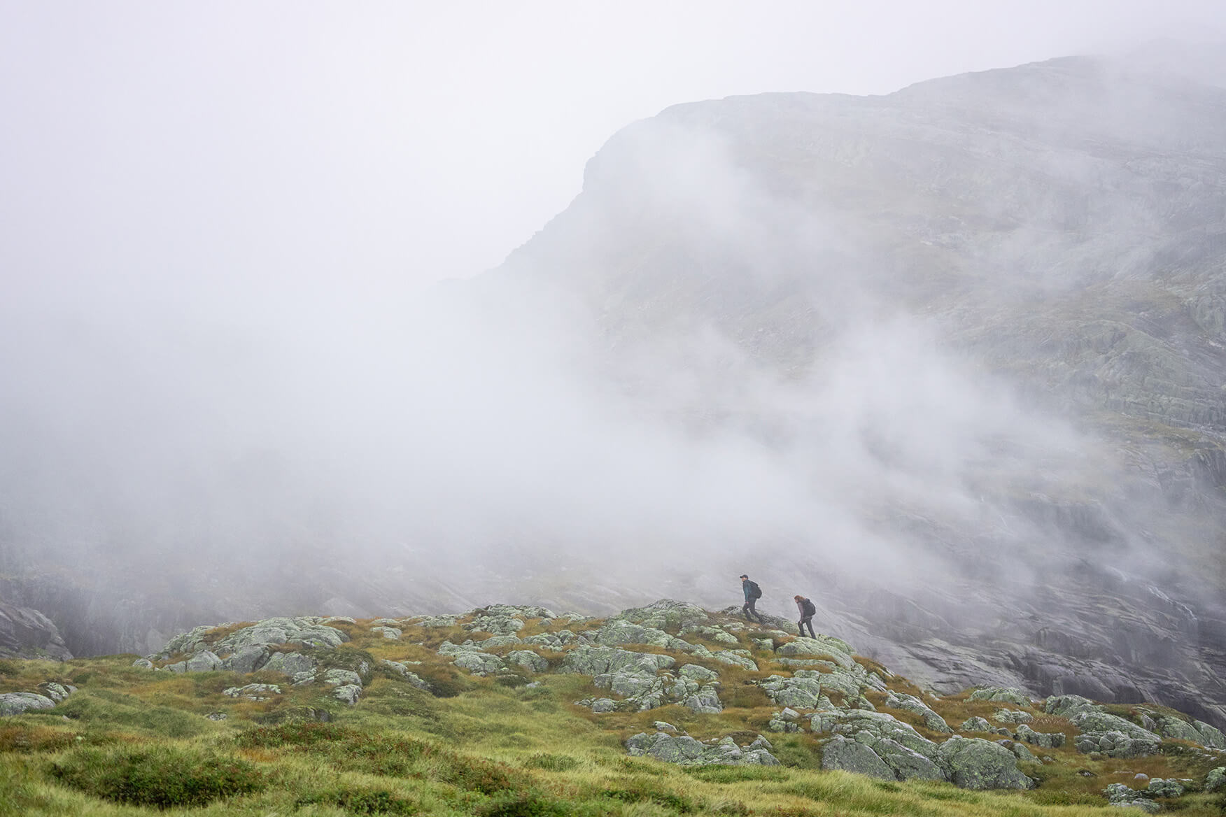 two people hiking in the mountains