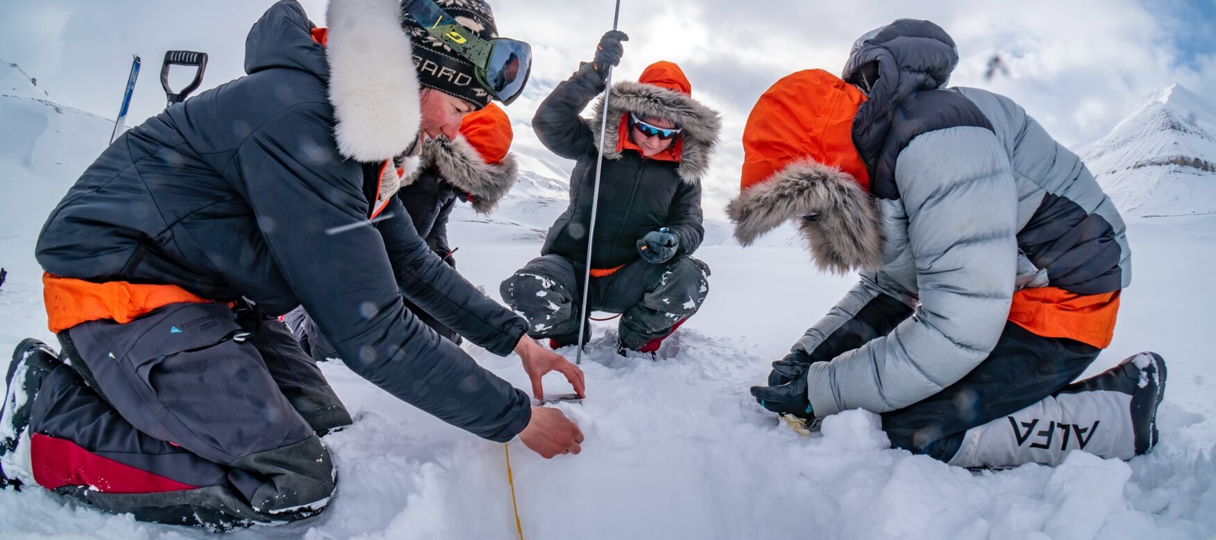 scientists conducting research in the arctic snow