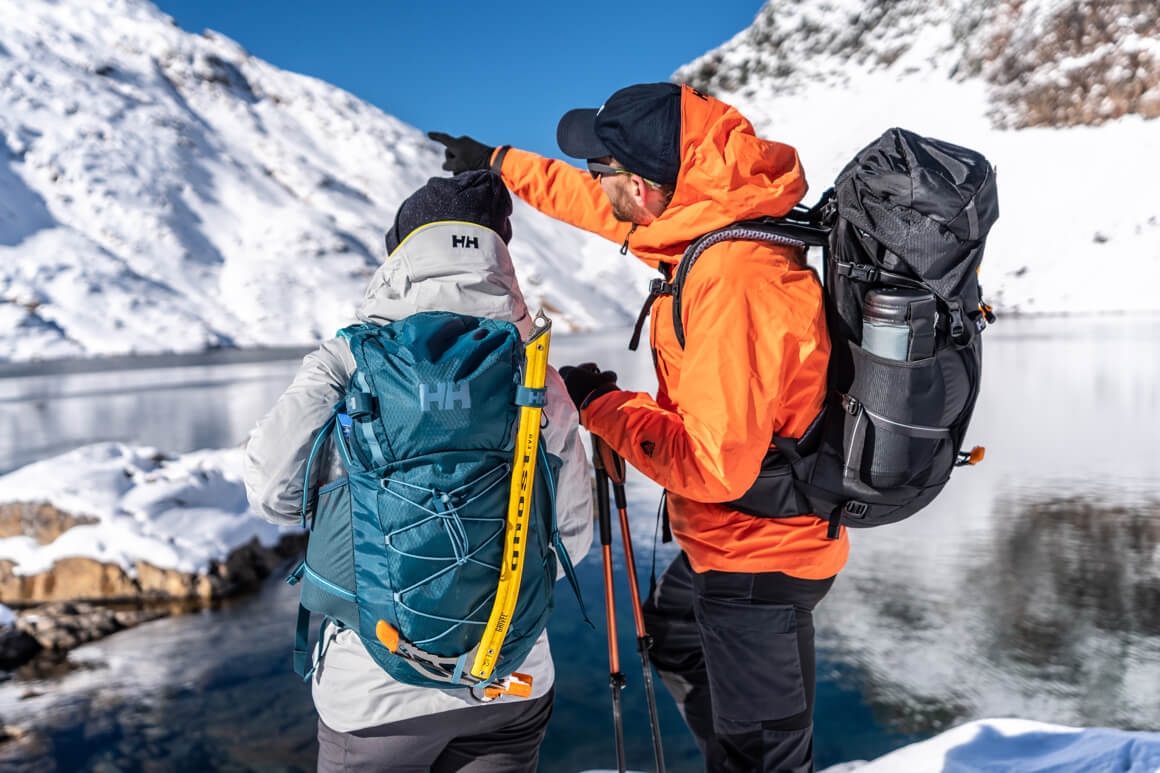 man and woman hiking on a mountain