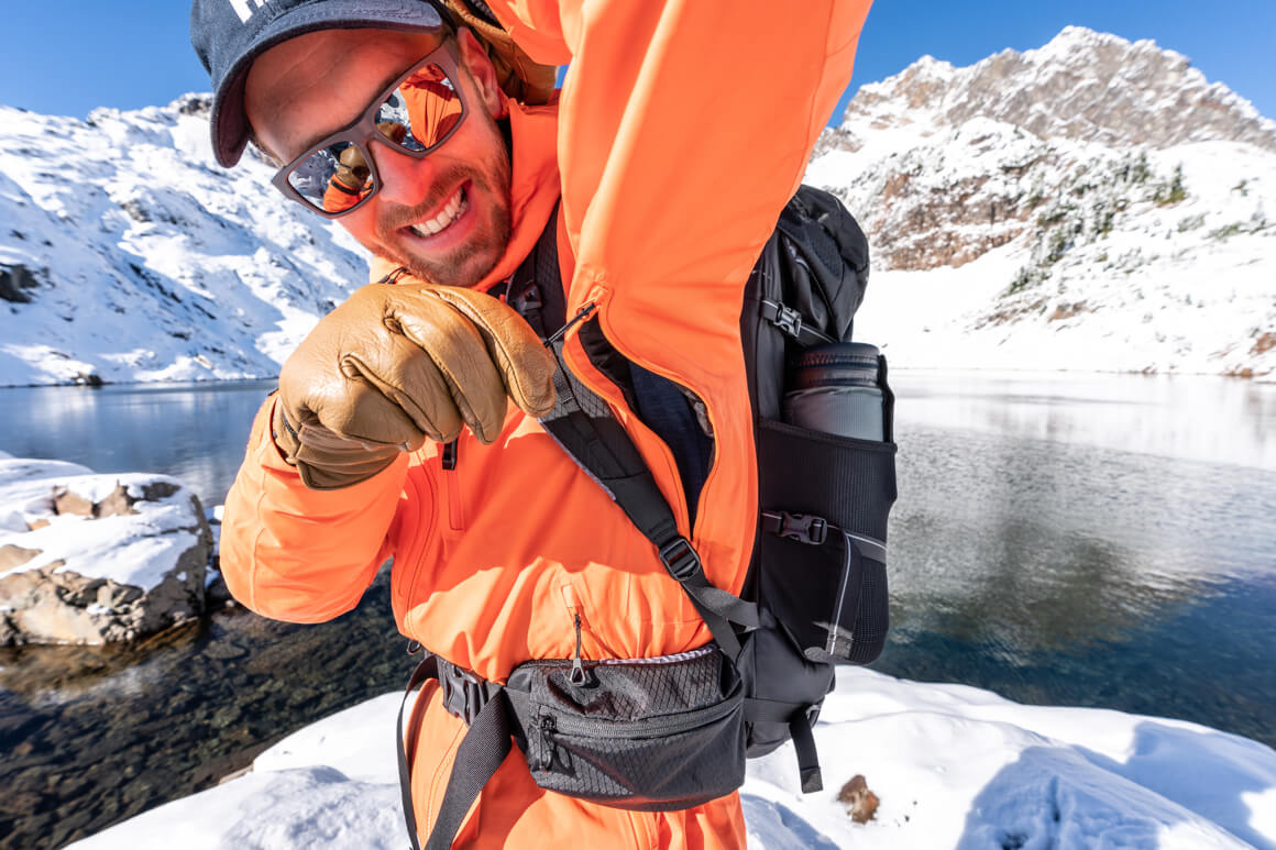 man unzipping vents of jacket