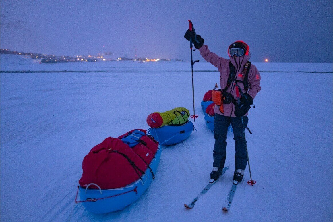 excited caroline cote by sled on skiis