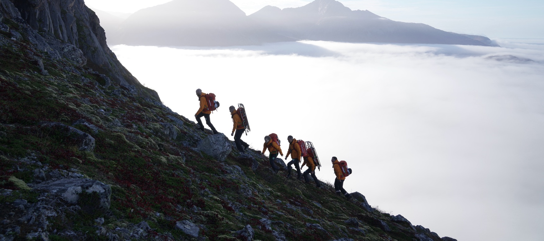 the team trekking up the mountain