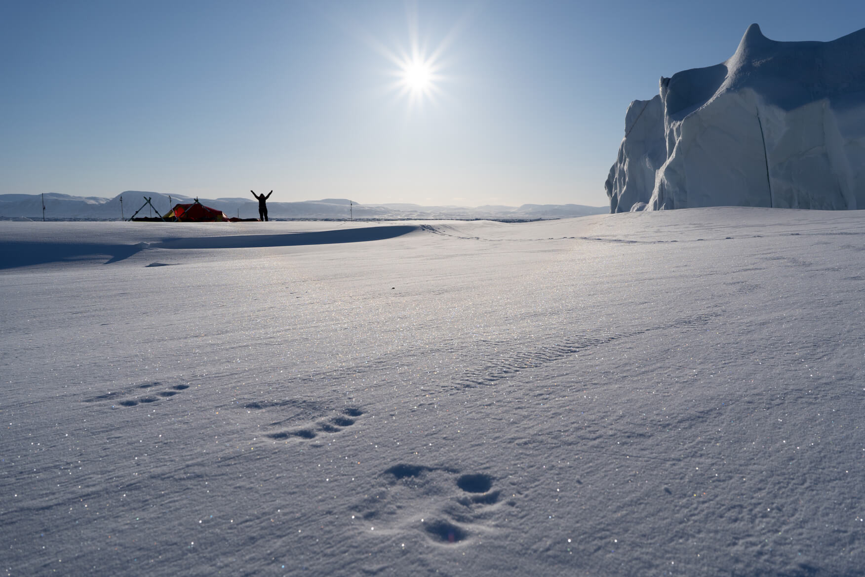 person snowshoeing in the middle of the snow