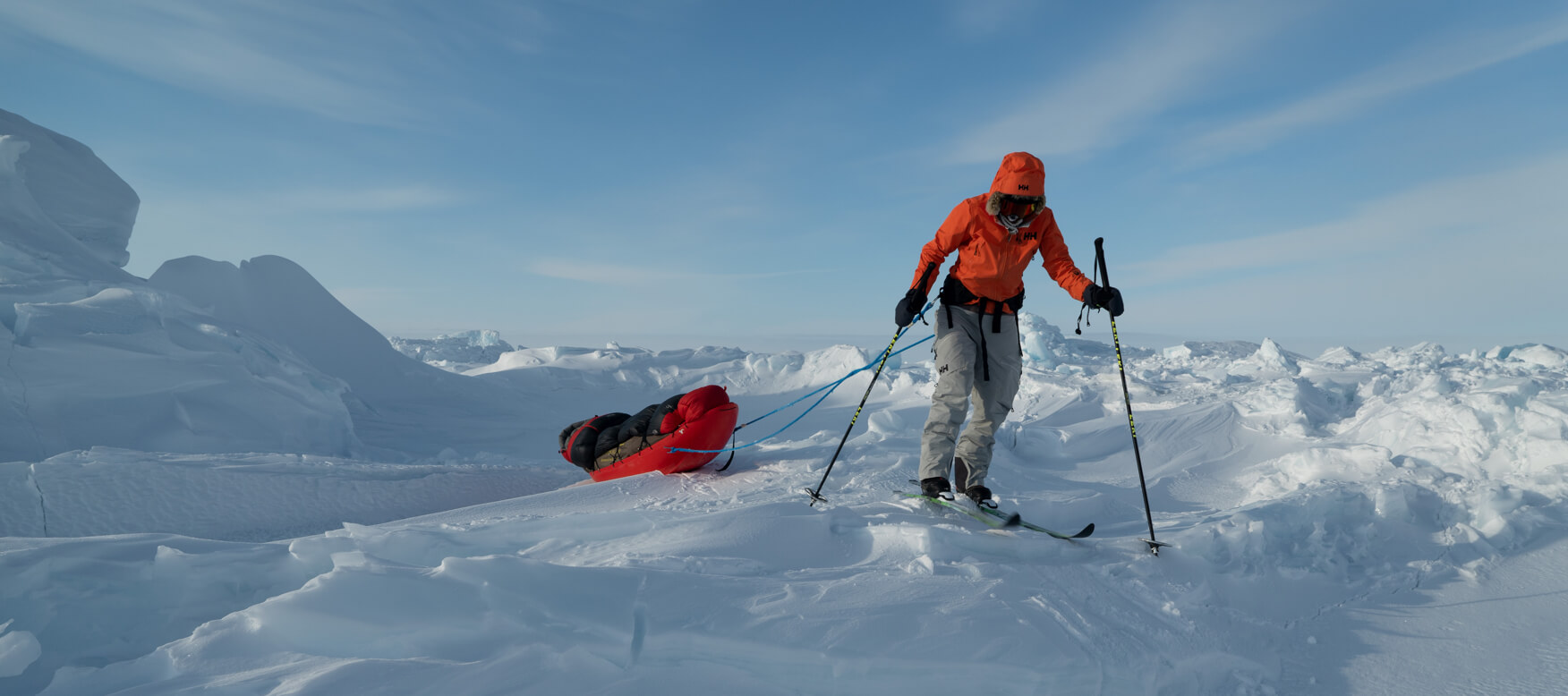 caroline snowshowing while dragging her sleigh behind