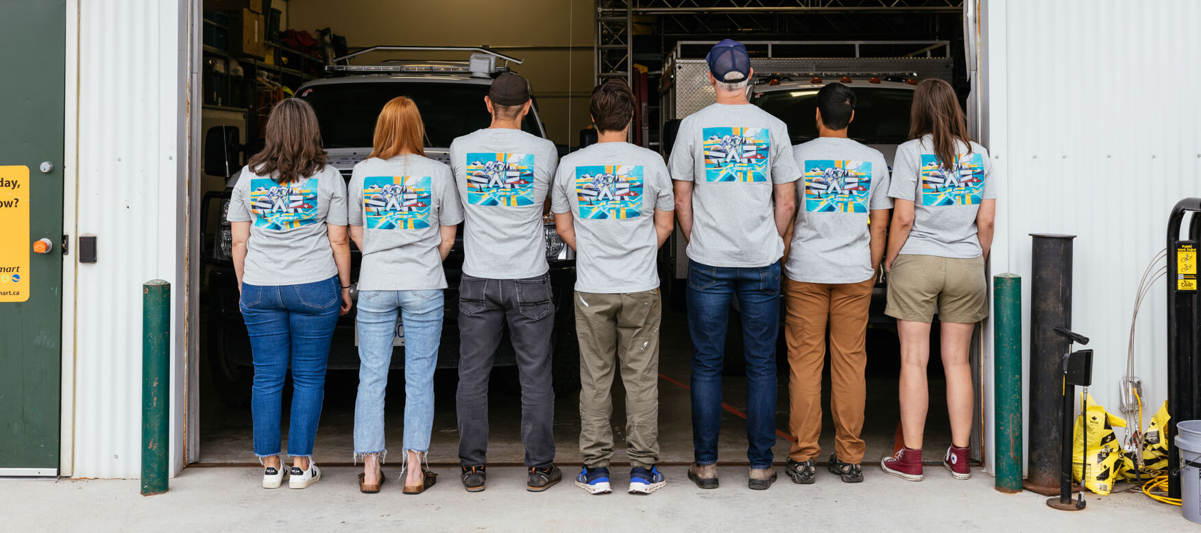 group of people wearing matching t-shirts 
