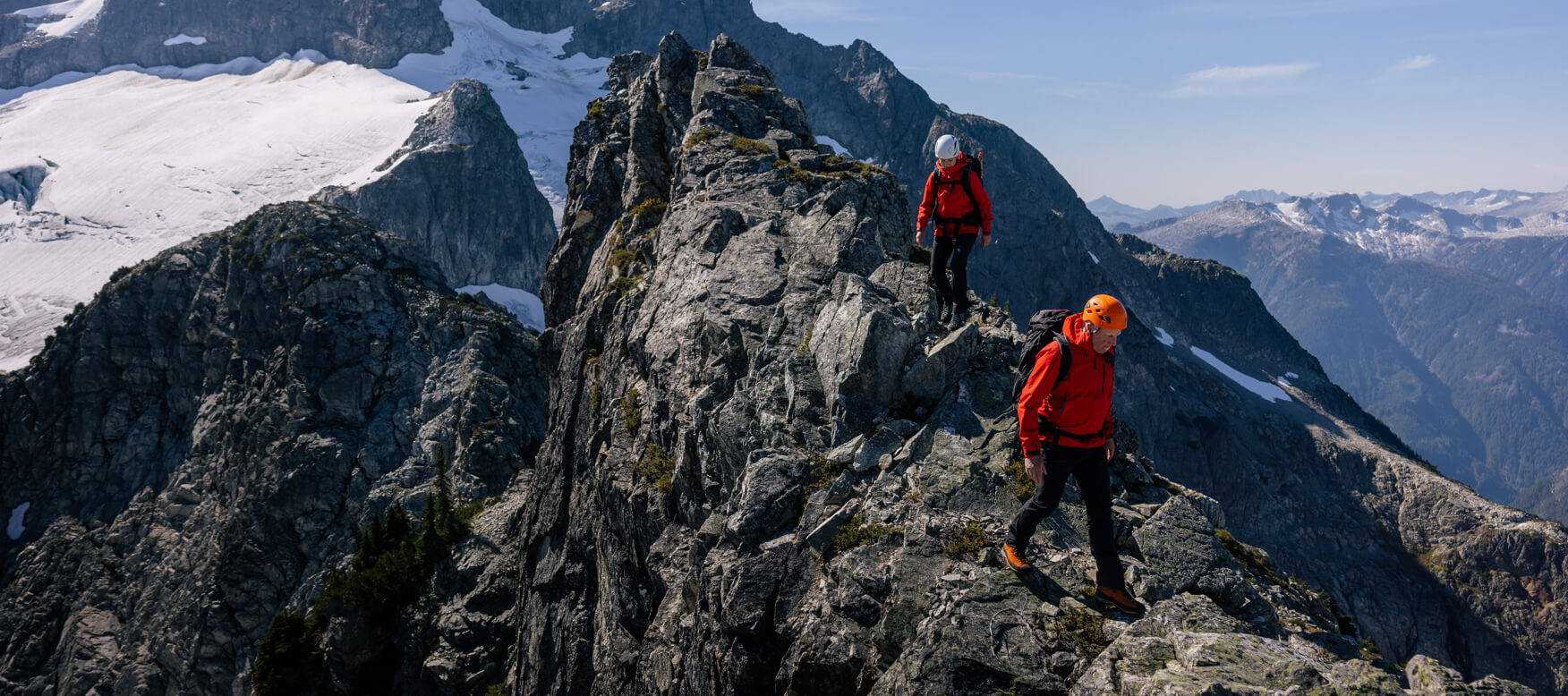 2 people climbing mountain in odin 9 worlds infinity shell jacket