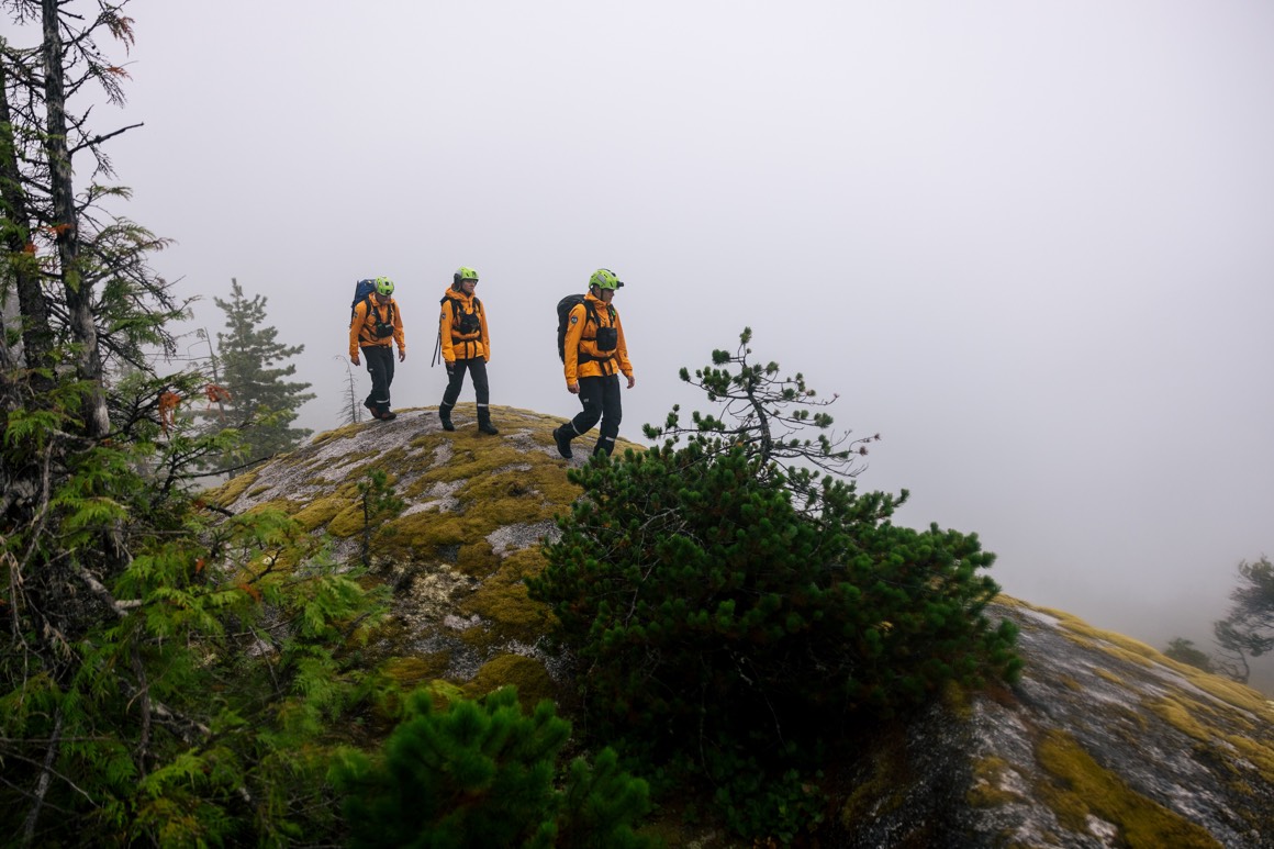 group of search and rescue professionals in the forest