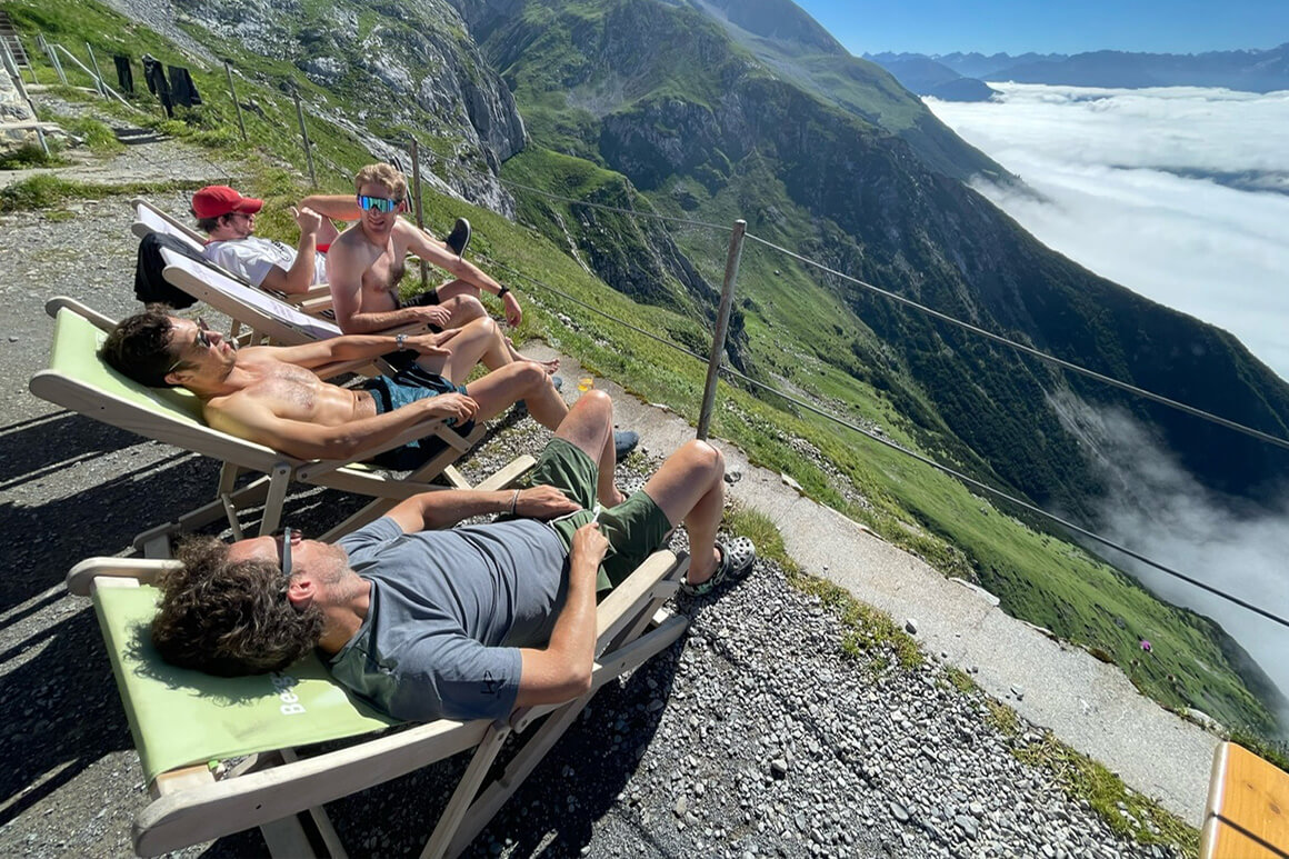 People sitting and enjoying the mountain view