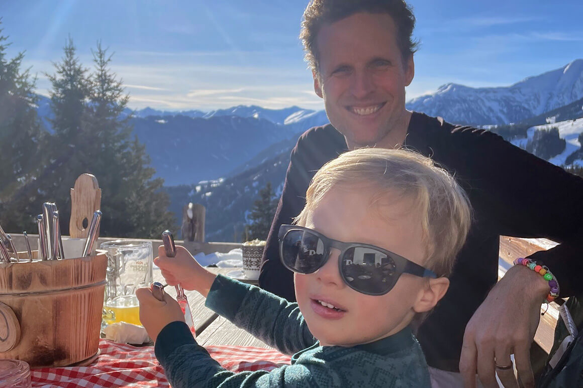 Man and a boy in a restaurant in the mountains