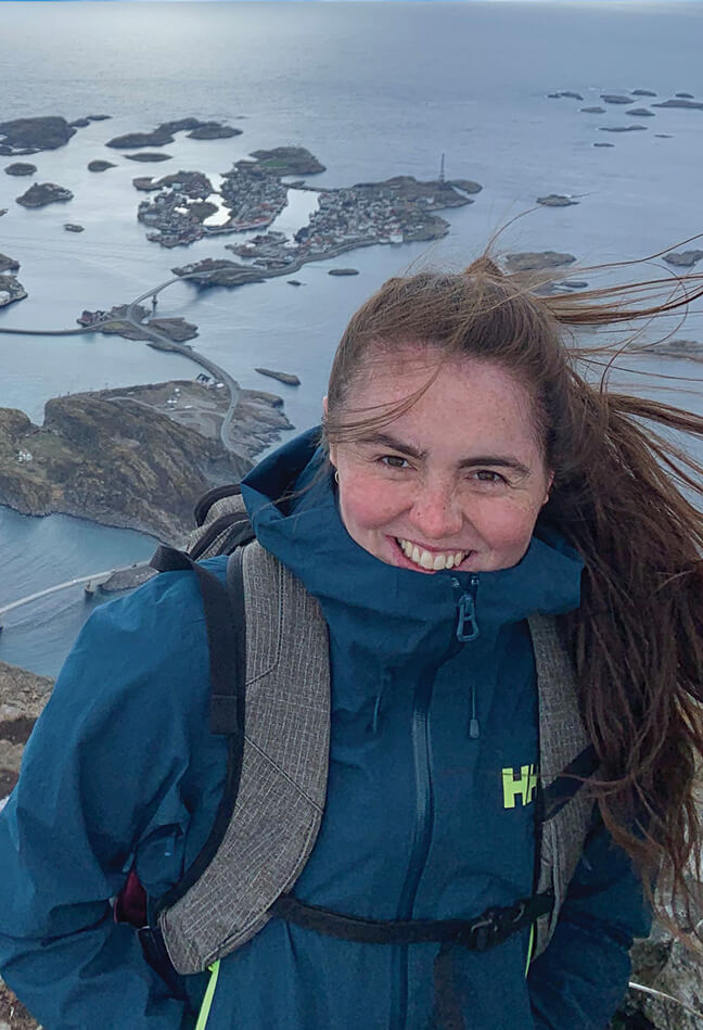 Woman on top of a mountain