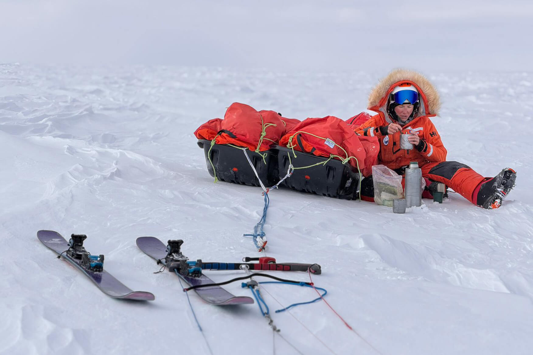 Glaciologist Heidi Sevestre eating lunch in Antarctica