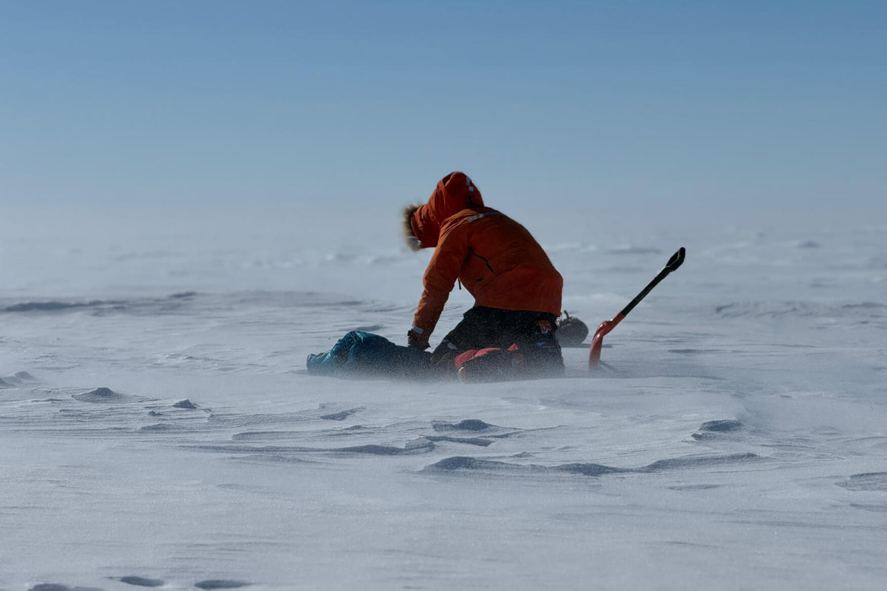 Glaciologist Heidi Sevestre working on the ice in Antarctica