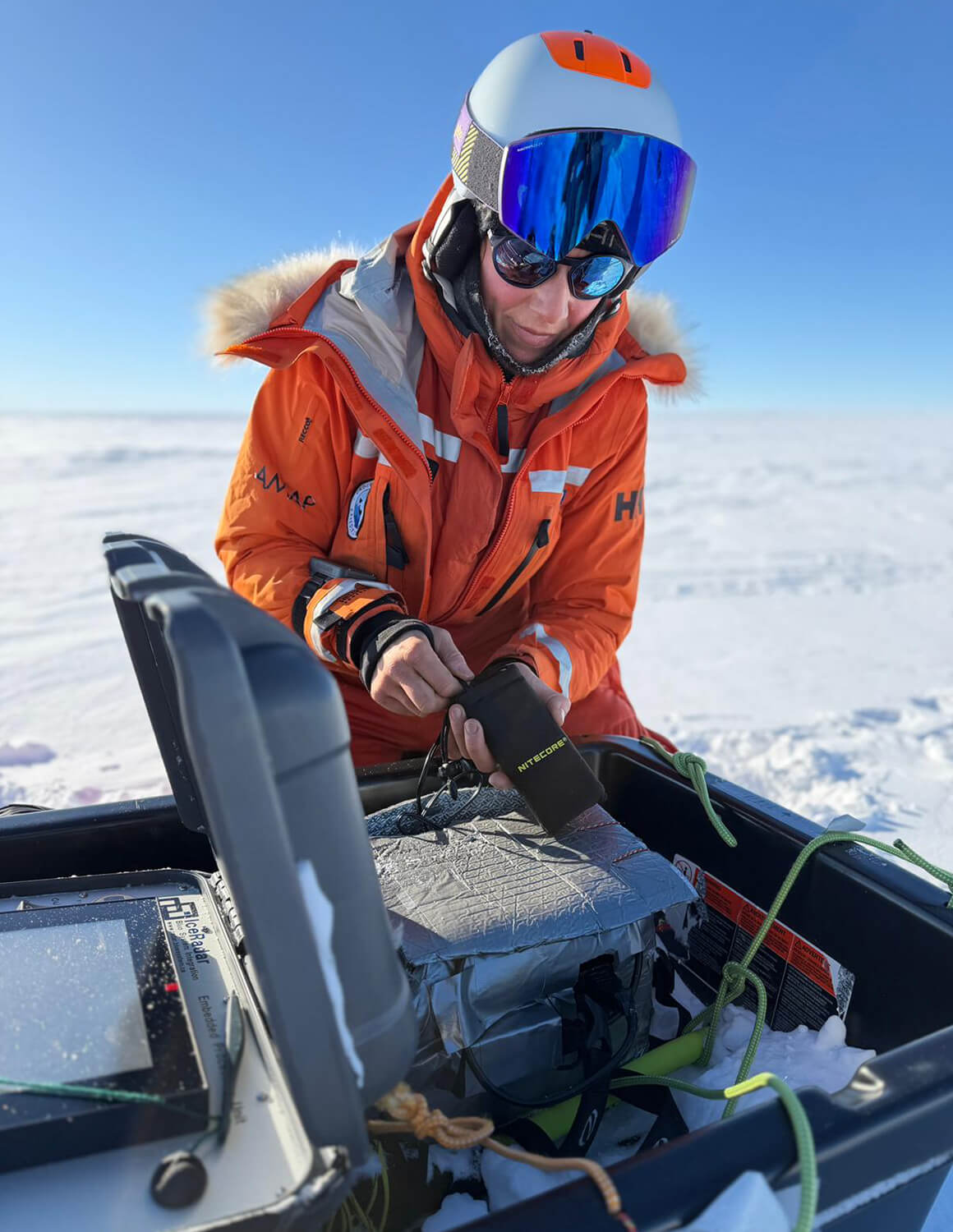 Glaciologist Heidi Sevestre setting up a radar during an expedition in Antarctica