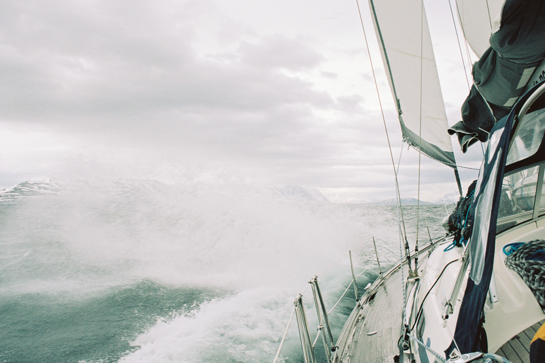 "Havblikk" in her right habitat. You should be prepared for all types of conditions when embarking on a ski & sail trip in Northern Norway. Sailboat along Norway's coast.