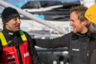 Three sailors on the dock after finishing the Vendee Globe