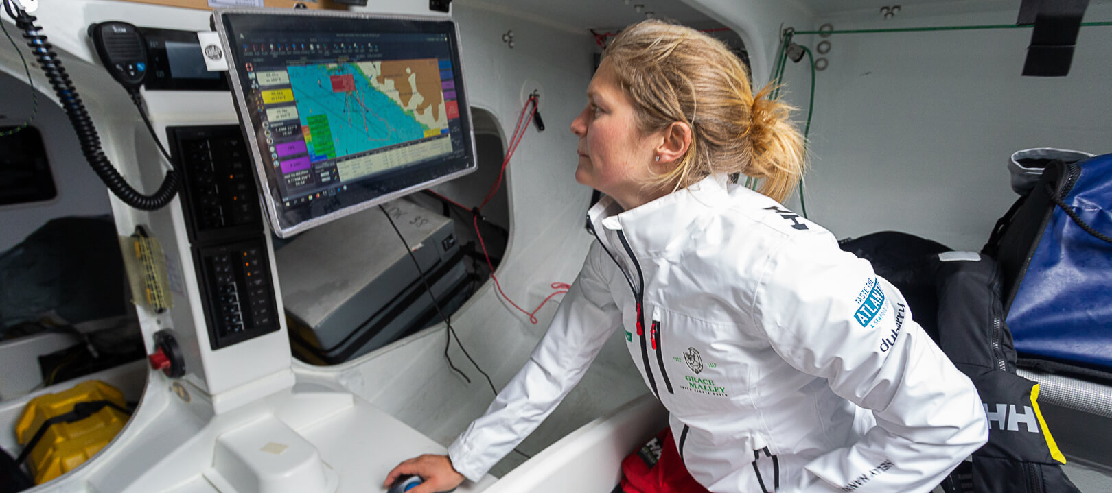 joan mulloy on ship looking at map