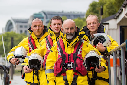 rnli team on the rocks in their gear