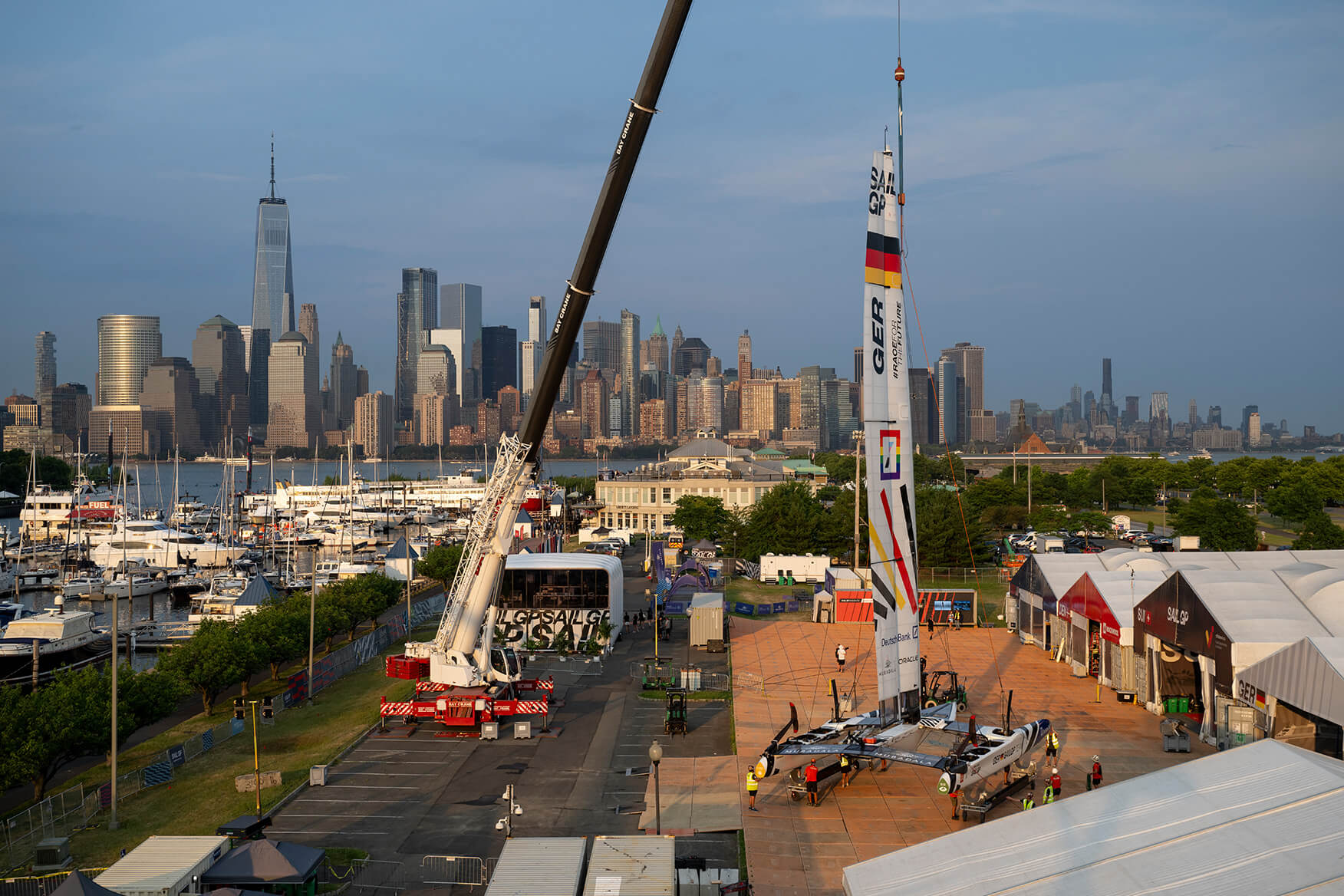 Germany SailGP Team’s F50 catamaran is craned back to the technical area