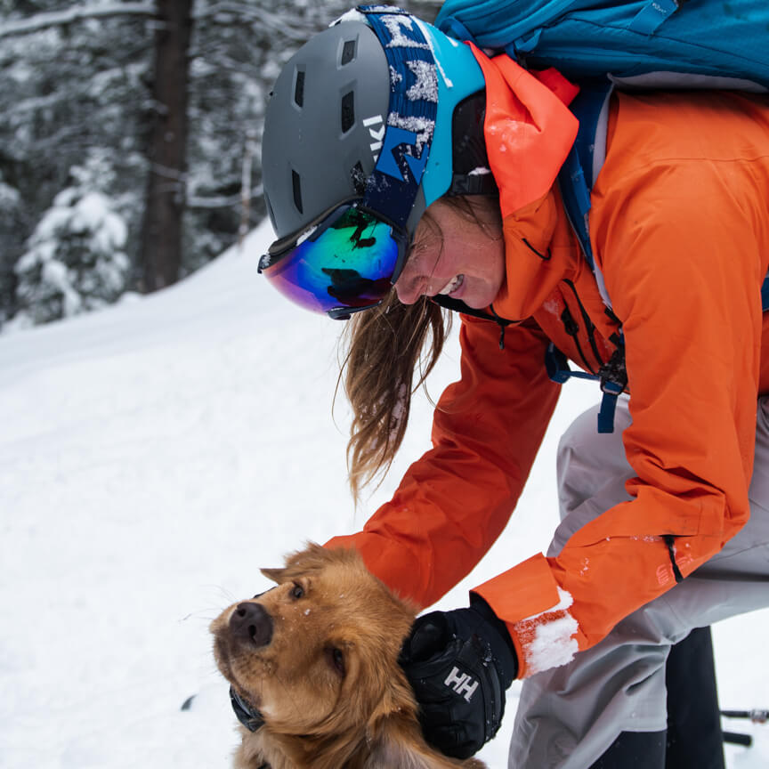 kaylin with a dog in the snow
