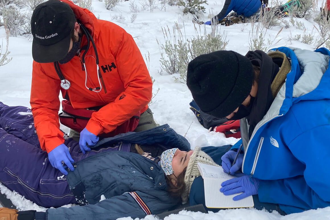 helping a woman on the slopes