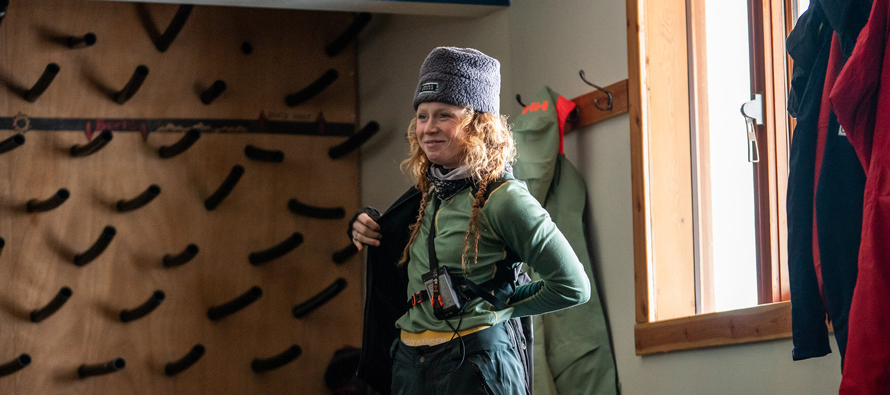 woman in lifa merino getting ready to head out to ski