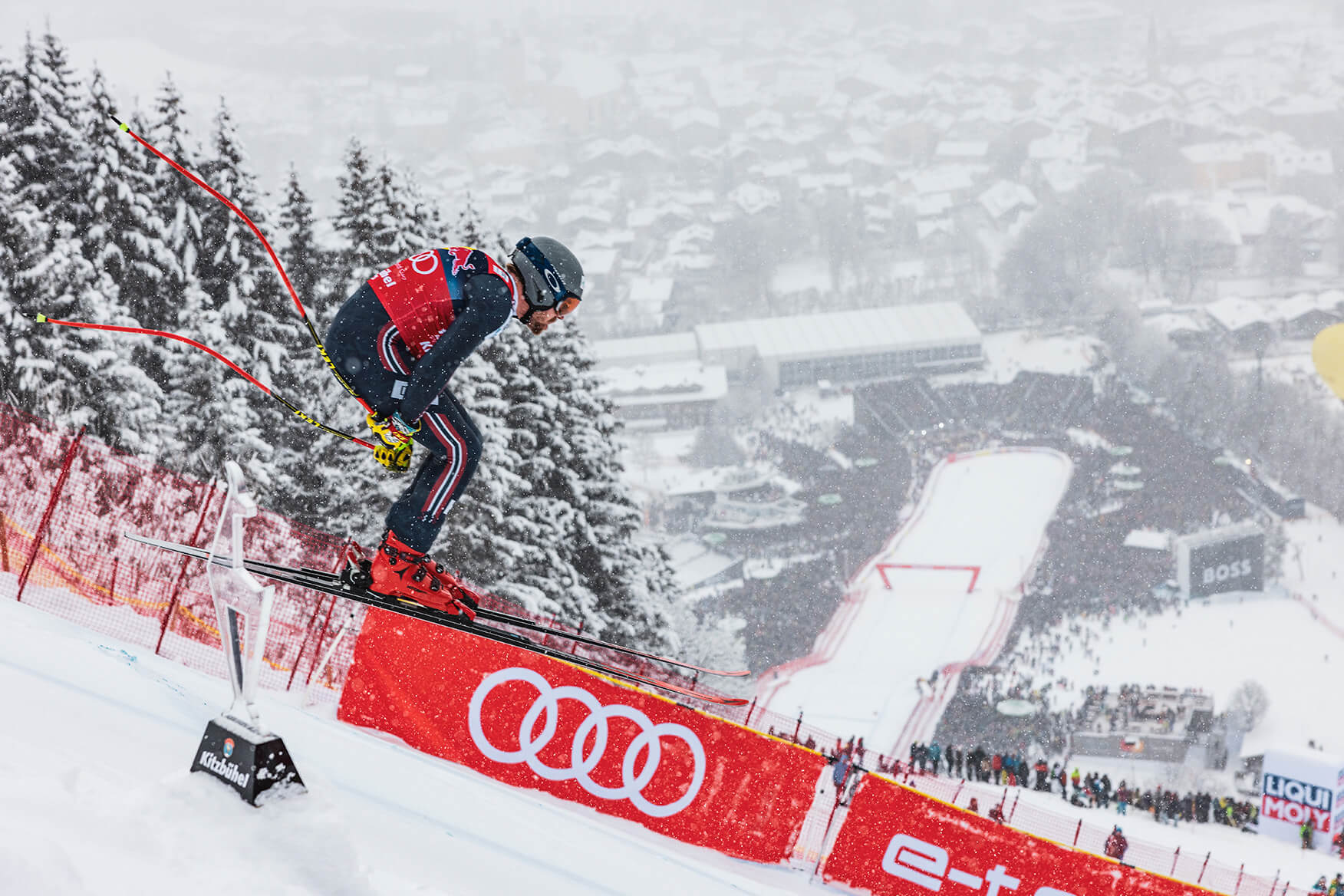 Downhill skier jumping in Kitzbühel