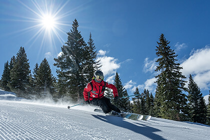 ski patroller on a groomed slope 