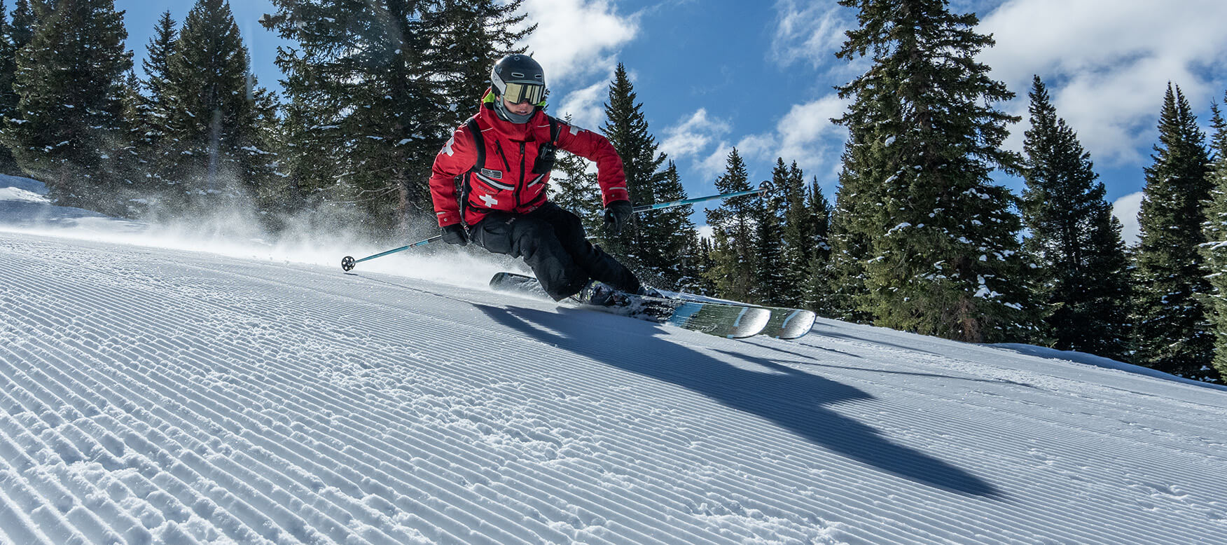 Vail ski patroller on a groomed slope