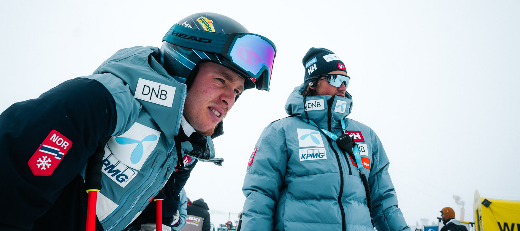 alpine skier talking with his coach