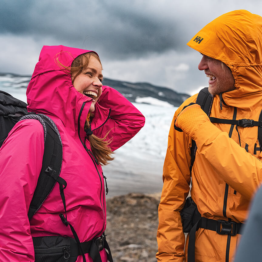 Man and woman smiling in the mountains