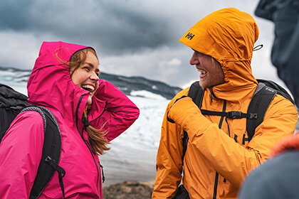 Man and woman smiling in the mountains