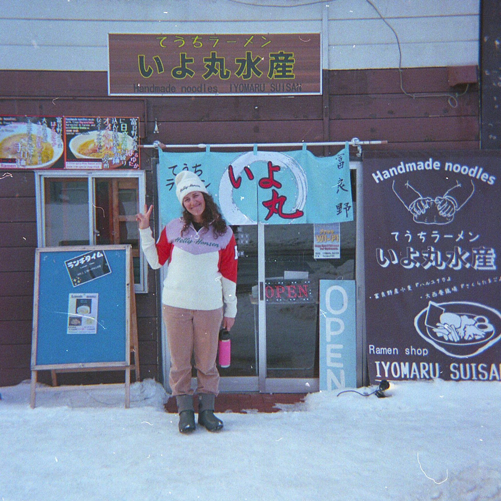 One of the many local restaurants we visited while eating our way across Hokkaido. Woman standing in front of Japanese restaurant