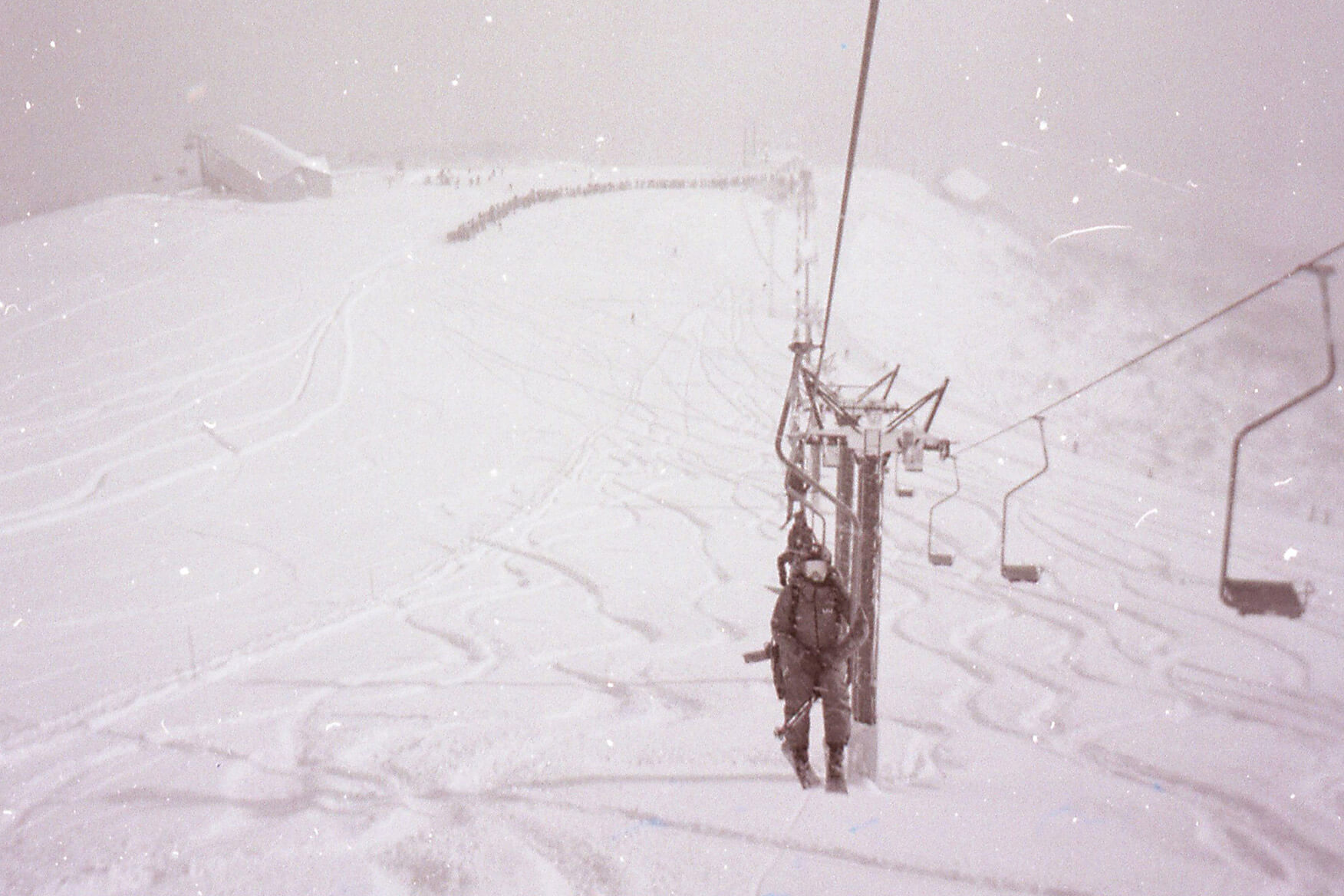 Riding the ‘pizza box’ on Hanazono to hike the peak of Mount Annapurna on one of two powder days we had during our trip. Skier on a ski lift