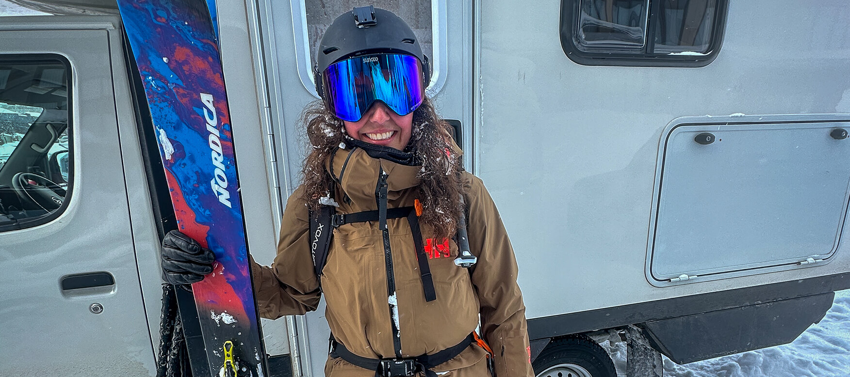 skier in front of an RV