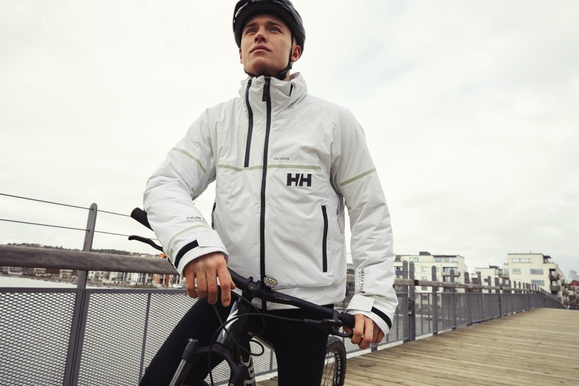 man in jacket on bike