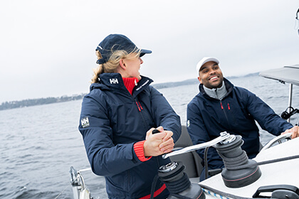 Man and woman sailing a boat