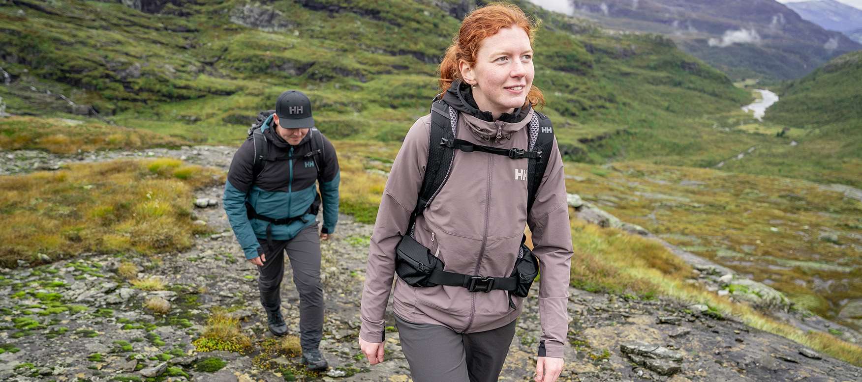 woman hiking in shell jacket and shell pants