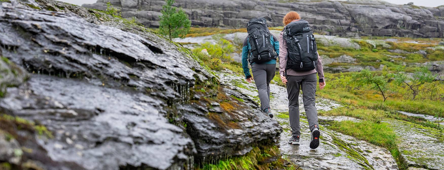 man and woman hiking in scenic nature