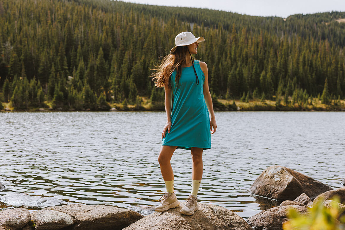 Woman standing by a lake