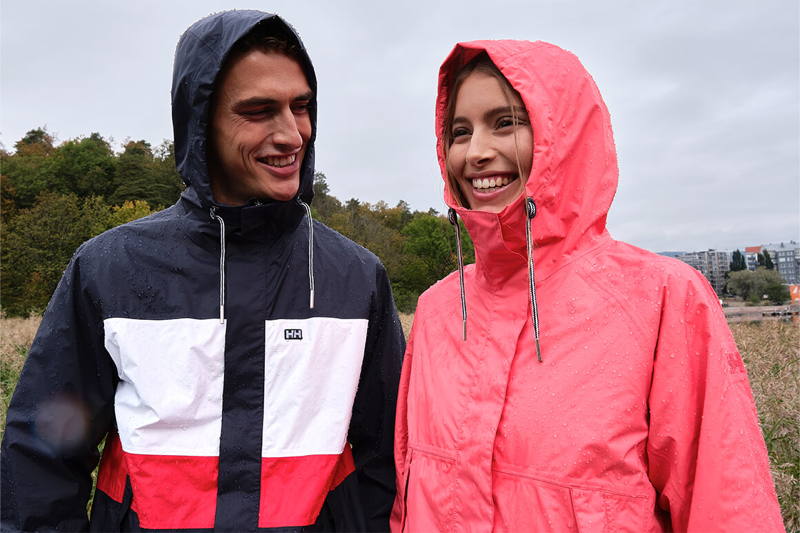 Man and woman standing in rain