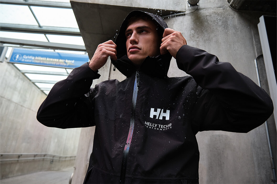 Man standing in the rain with a hood on