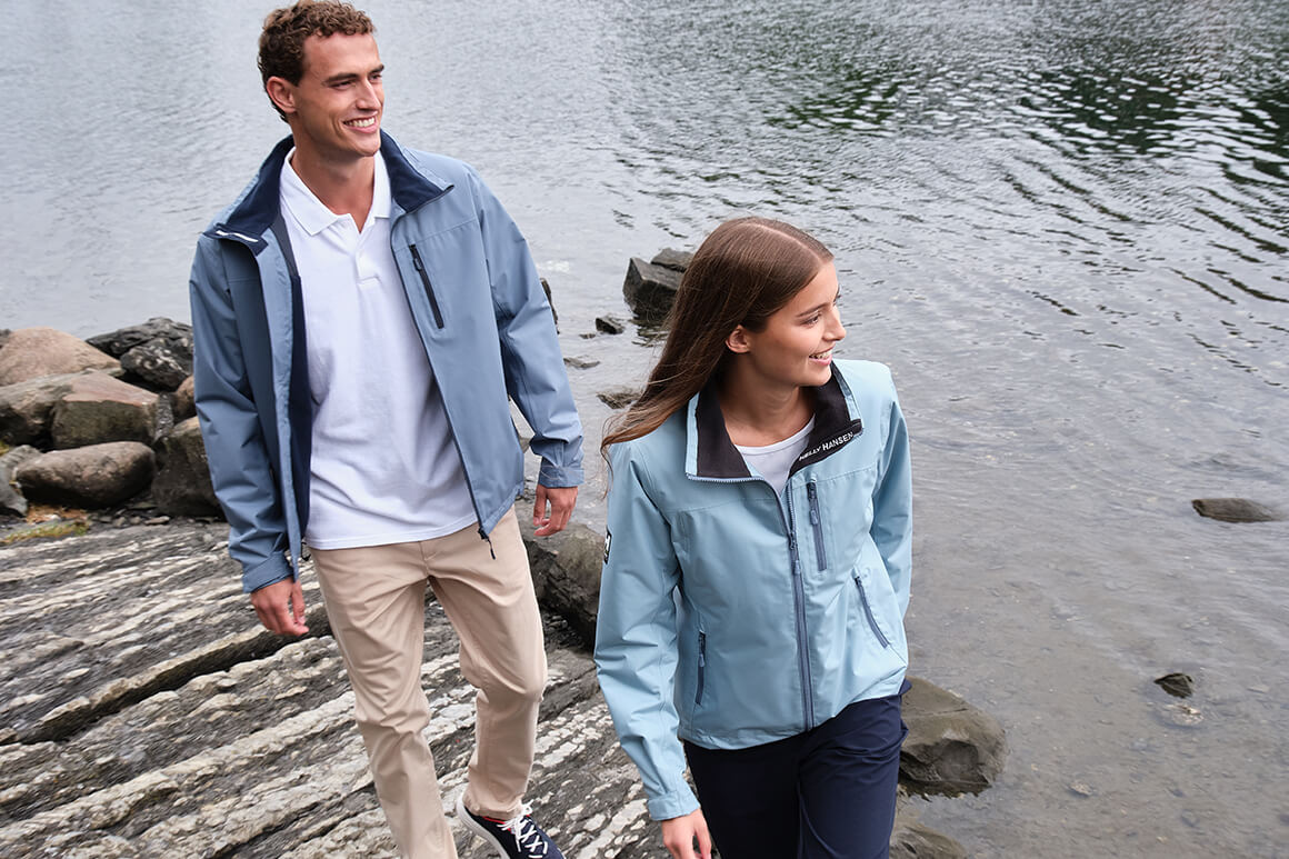 Man and woman hiking along the coast