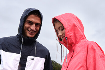 man and woman standing in rain