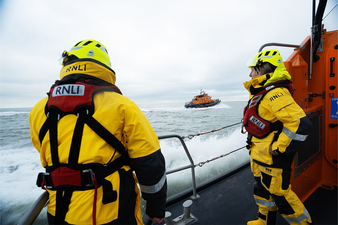 RNLI lifeboat with two crew members