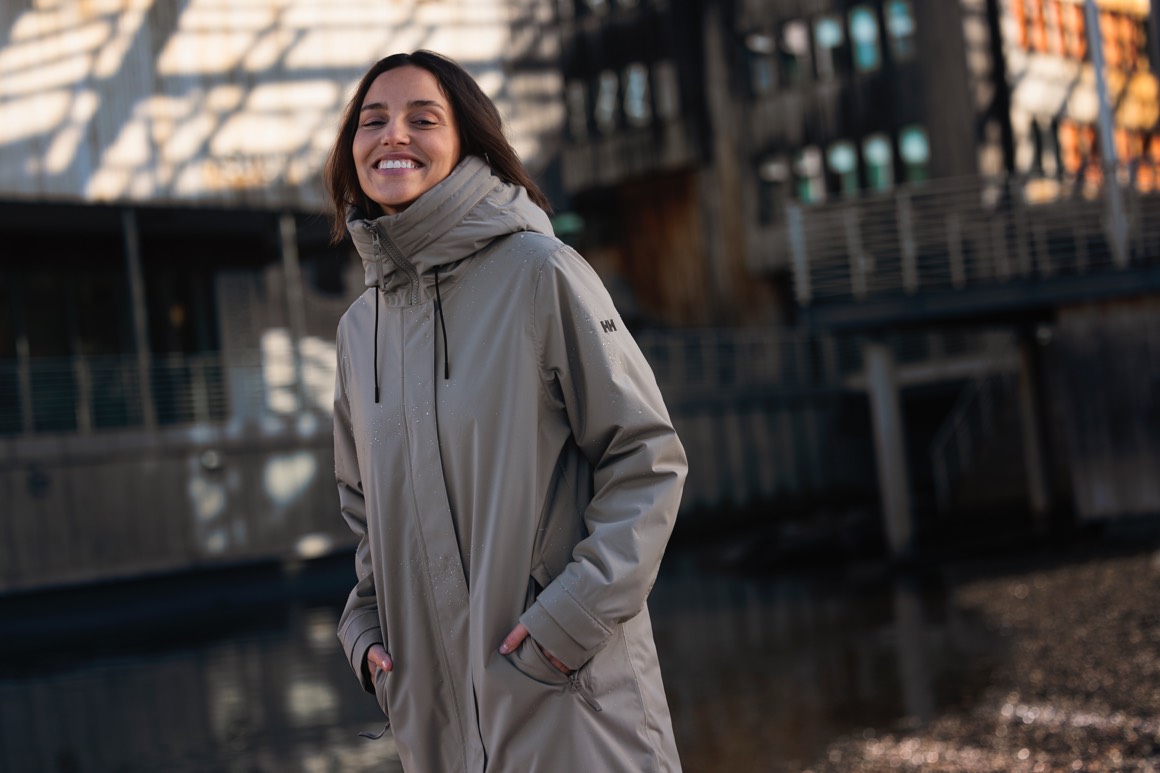 Woman wearing a grey rain jacket