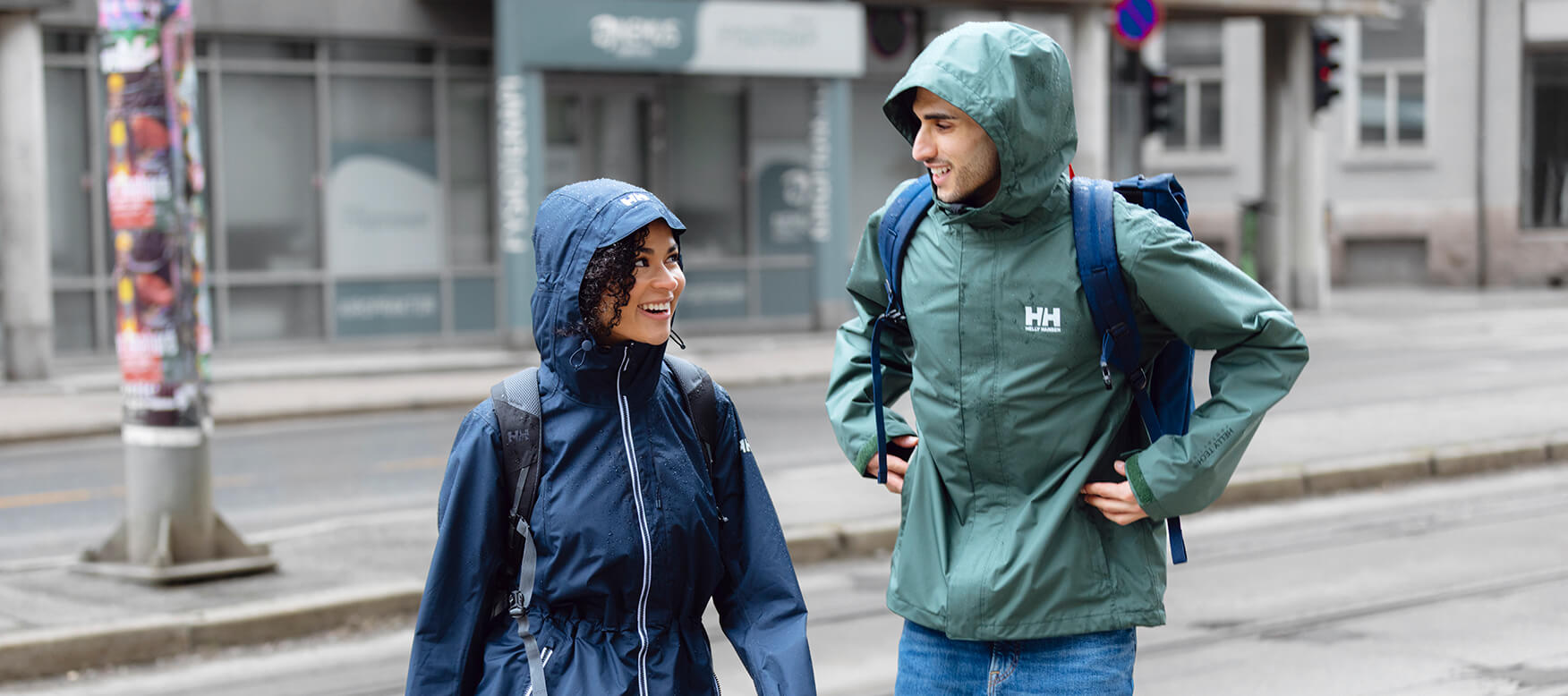 two people in the rain