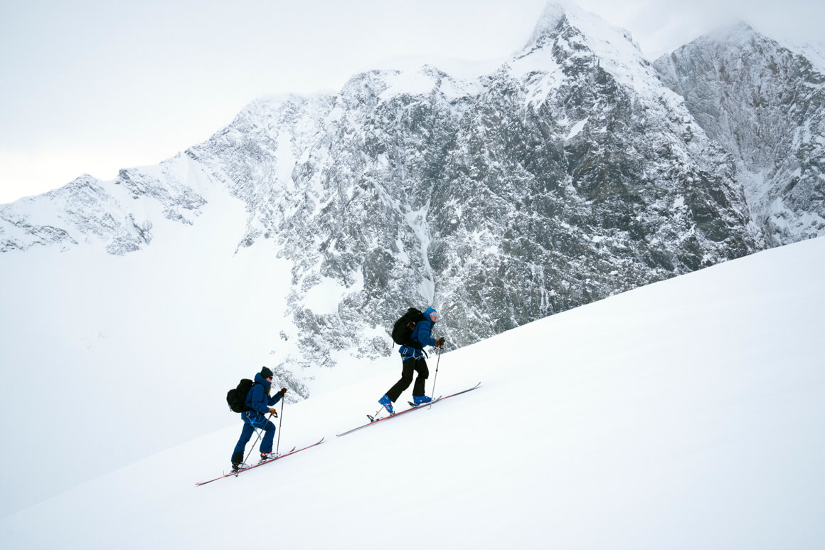 2 people hiking in the snow