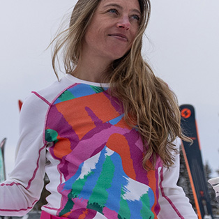 A woman wearing a colorful base layer.