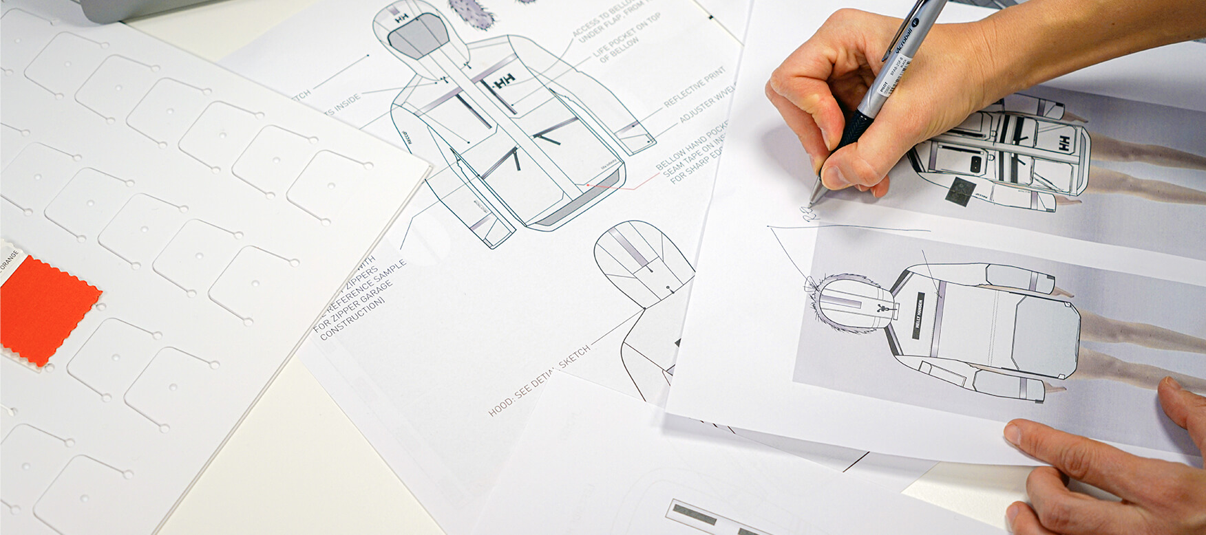 The design team at work on the Arctic Patrol Down Parka