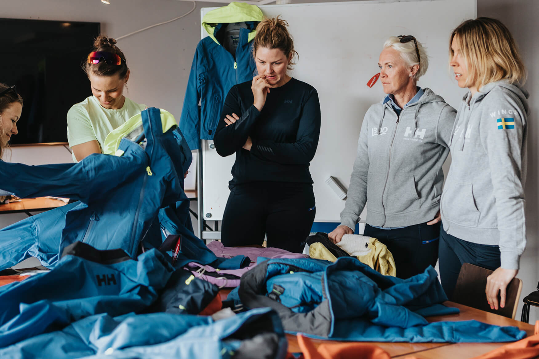 Sailors and designers discussing the development of the jacket